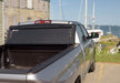 Toyota tundra double cab truck bed cover with boat in background