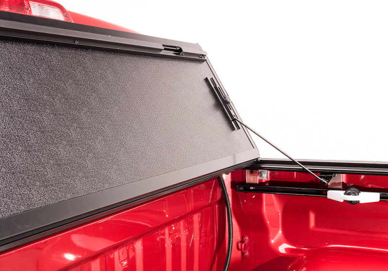 Red truck with open door - bakflip g2 for toyota tundra double cab