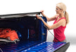 Woman loading bag in truck - bakflip mx4 matte finish installation guide