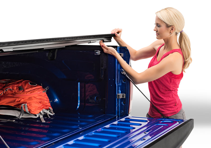 Woman loading bag in truck - bakflip mx4 matte finish installation guide