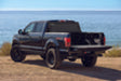 Black truck driving down dirt road - bak 04-14 ford f-150 5ft 6in bed bakflip mx4 matte finish installation instructions