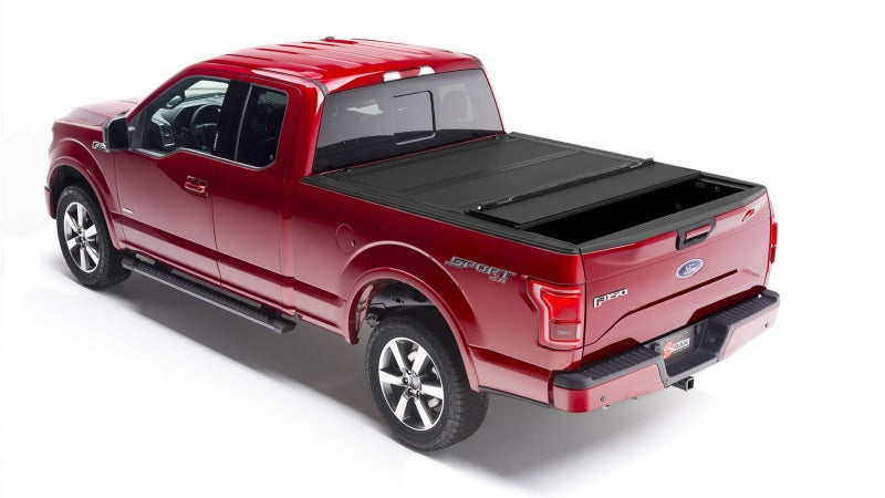 Red truck with black bed cover - bakflip mx4 matte finish for 04-14 ford f-150