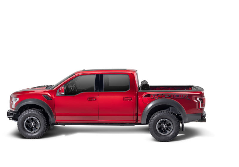 Red ford f-150 revolver x4s bed cover truck with black bumper and wheels