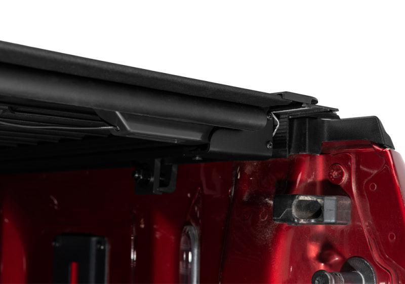 Red ford f-150 revolver x4s truck bed cover with black roof rack