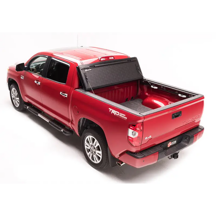 Red truck with black bed cover - BAK 05-15 Toyota Tacoma 5ft Bed BAKFlip G2