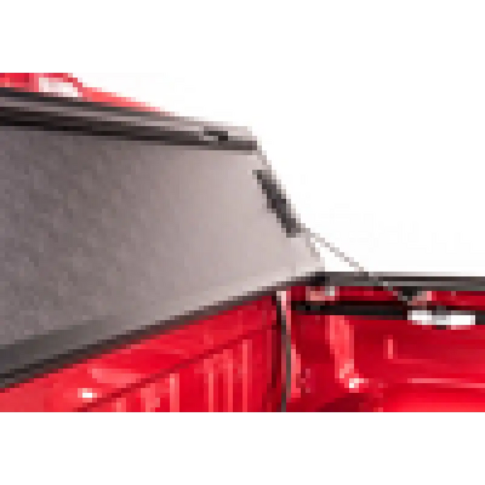 Red truck rear window view in BAK 05-15 Toyota Tacoma 5ft Bed BAKFlip G2 product.