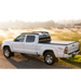 White truck driving down a dirt road - BAK 05-15 Toyota Tacoma 6ft Bed BAKFlip G2