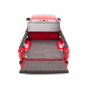 Red pickup truck with open bed - BAK 05-15 Toyota Tacoma 6ft Bed BAKFlip G2