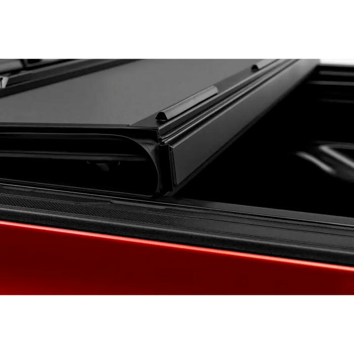 Red car rear window view on BAKFlip MX4 matte finish for Toyota Tacoma 6ft Bed installation instructions