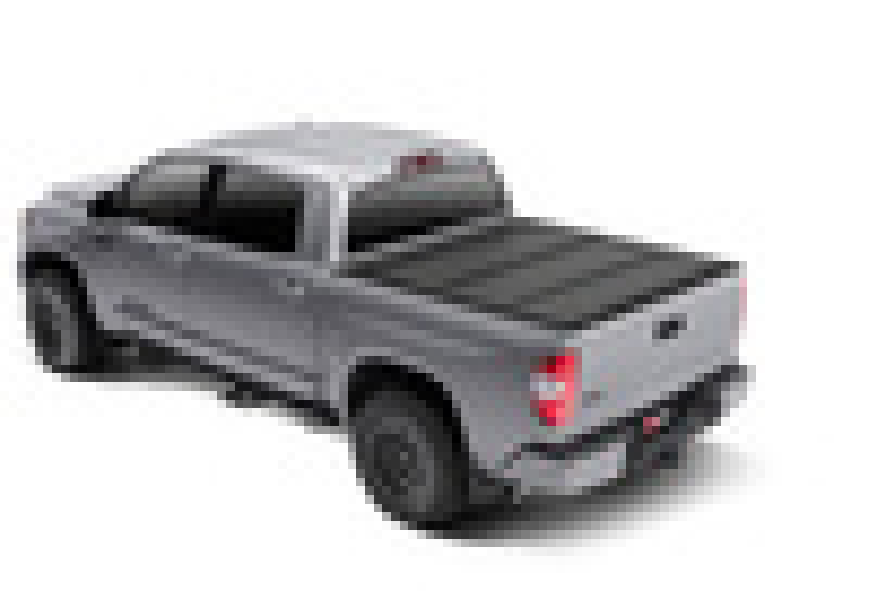 Toy car with red light on back displayed in bak 07-20 toyota tundra 5ft 6in bed bakflip mx4 matte finish