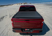 Red truck parked on beach with bak 07-20 toyota tundra bakflip mx4 matte finish