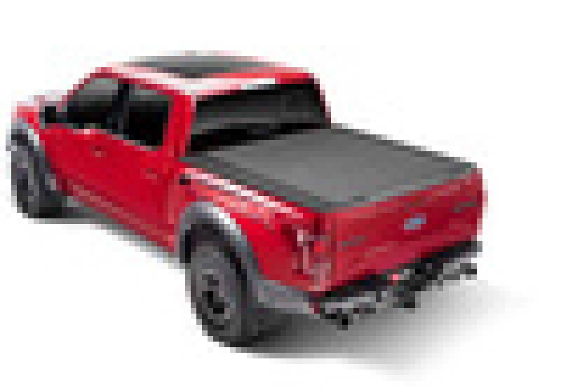 Red truck on white background showcasing bak 07-20 toyota tundra revolver x4s 5.7ft bed cover