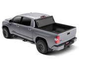 Bakflip mx4 matte finish truck bed cover installed on toyota tundra with oe track system