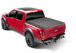 Red truck on white background showcasing bak revolver x4s 8.2ft bed cover for ford super duty