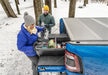 Couple loading cooler box into dodge ram truck with bakflip mx4 matte finish