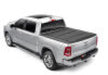 White truck with red tail light on bakflip mx4 matte finish for dodge ram 1500 bed