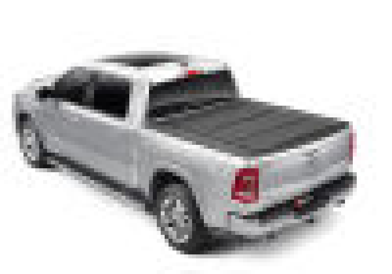 White truck with red tail light on bakflip mx4 matte finish for dodge ram 1500 bed