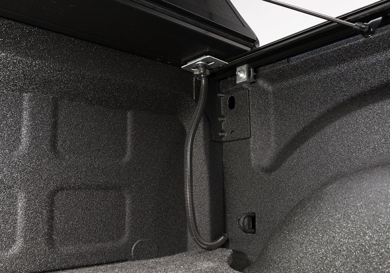 Interior of dodge ram 1500 truck bed with door open, featuring bakflip g2 product