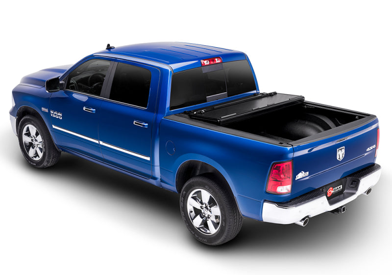 Blue truck with black bed cover - bakflip g2 for 09-18 dodge ram 1500 5ft 7in bed