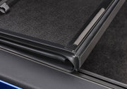Bakflip g2 truck bed cover with open door on car side