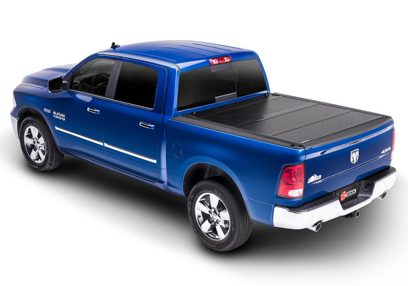Blue truck with black bed cover on bak 12-18 ram 1500 / 12-20 2500/3500 6ft 4