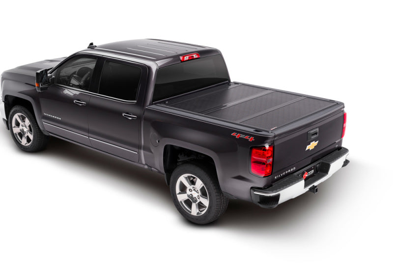 Black truck bed cover for chevy silverado with easy installation instructions in bakflip g2