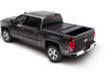 Black toy car with red light on top displayed in bak 14-18 chevy silverado 1500 truck bed product