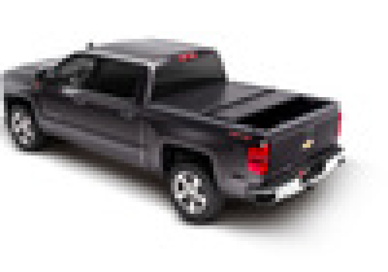 Black toy car with red light on top displayed in bak 14-18 chevy silverado 1500 truck bed product