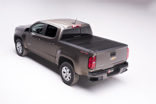 Chevy colorado/gmc canyon truck with black bed cover - bakflip g2