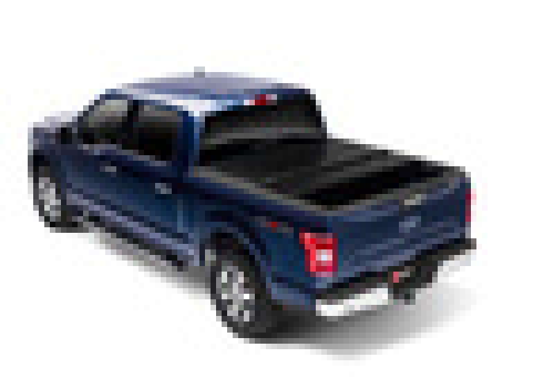 Toy truck with a black bed displayed on bakflip fibermax for ford f-150 5ft 6in bed