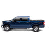 Blue truck in bak 15-20 ford f-150 6ft 6in truck bed cover on white background