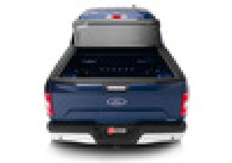 Blue ford f-150 truck bed rear view: bakflip g2