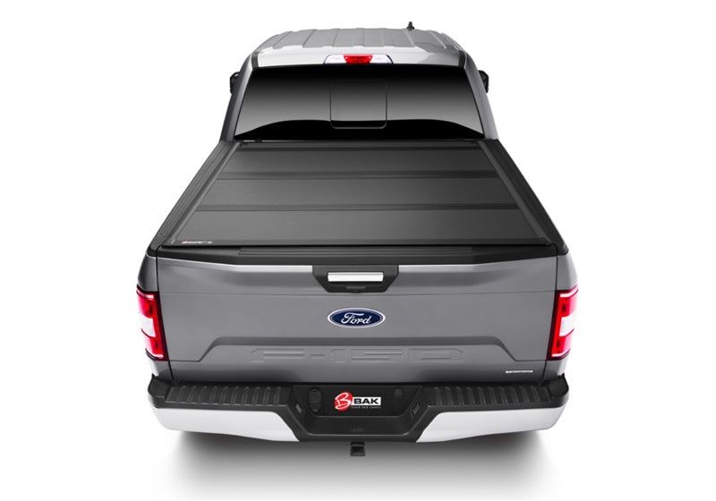 Matte finish bakflip mx4 on gray ford f-150 truck bed with tail light on