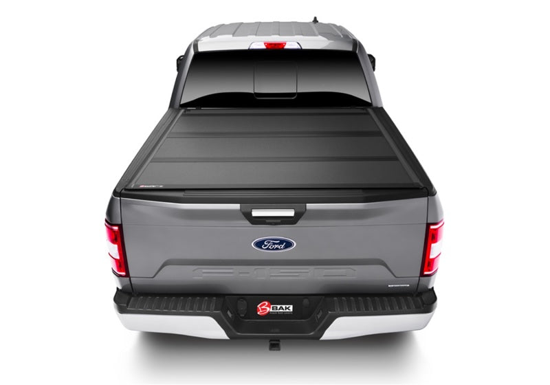 Gray truck with tail light on, bak 15-20 ford f-150 8ft bed bakflip mx4 matte finish