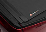 Red suitcase with black handle on bak 15-20 ford f-150 revolver x4s 5.7ft bed cover