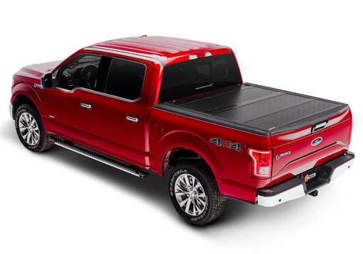 Red truck with black bed cover: bak 16-20 nissan titan 5ft 6in bed bakflip g2