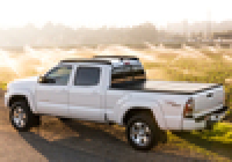 White truck on road with bak 16-20 nissan titan 5ft 6in bed bakflip g2 product