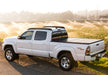 White truck parked on dirt road, bak 16-20 nissan titan 5ft 6in bed bakflip g2