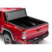 Red truck with bed cover open: BAKFlip MX4 installation instructions for 16-20 Toyota Tacoma.