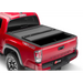 Red truck with BAK 16-20 Toyota Tacoma 6ft Bed BAKFlip MX4 Matte Finish