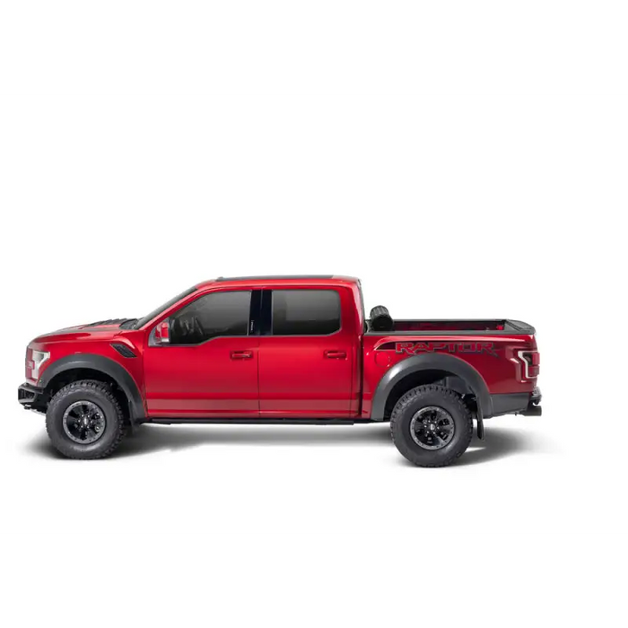 Red truck with black bumper and wheels - BAK Revolver X4s 5.1ft Bed Cover