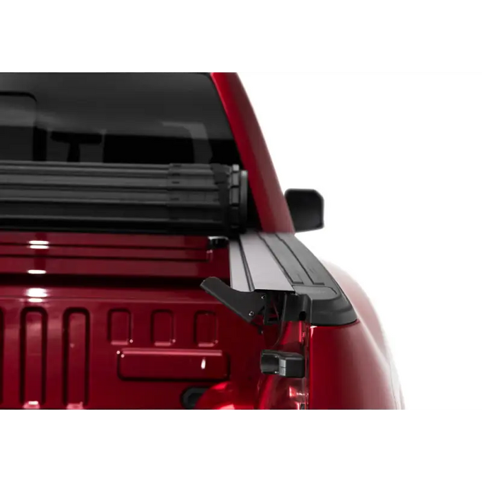 Red truck with roof rack, BAK Revolver X4s bed cover for 16-20 Toyota Tacoma.