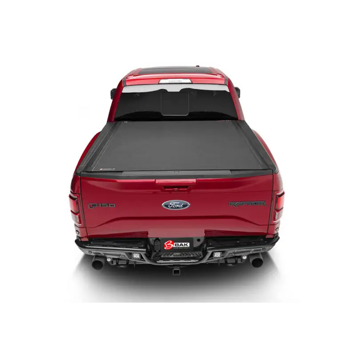 Red Ford Mustang seen from the rear_VIEW displayed in BAK 16-20 Toyota Tacoma Revolver X4s bed cover