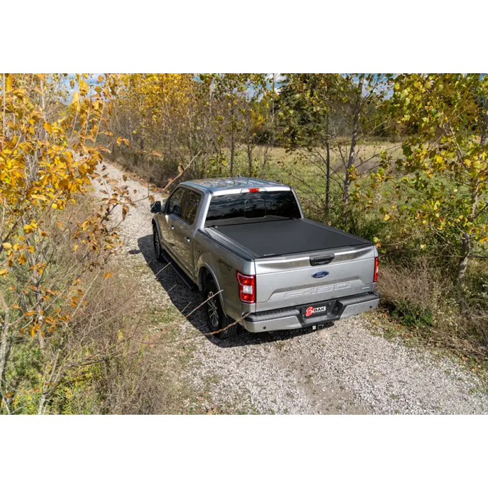 16-20 Toyota Tacoma Revolver X4s bed cover with truck parked on dirt road