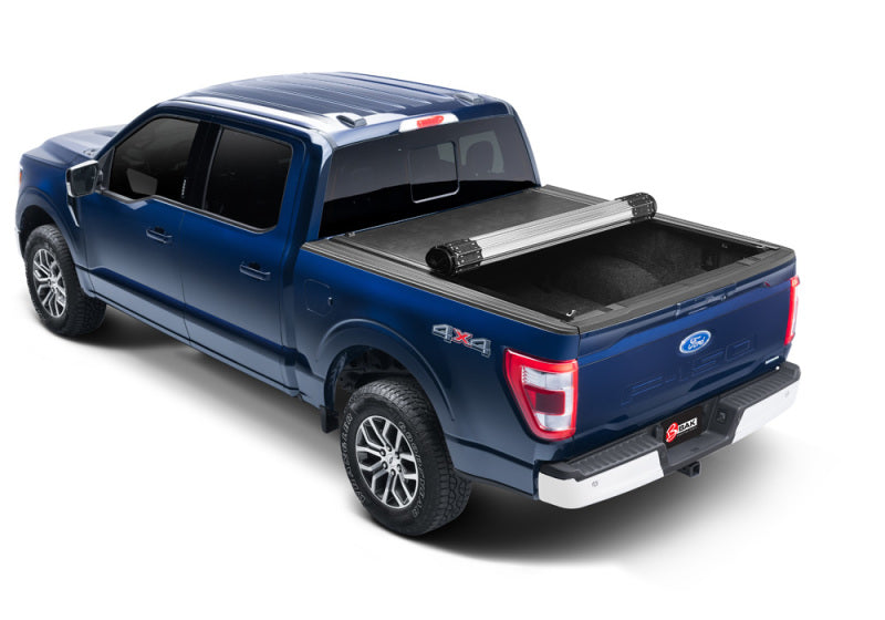 Ford super duty 8ft truck bed with revolver x2 tonneau cover on white background