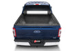 Blue ford truck bed installed with bak 17-23 revolver x2