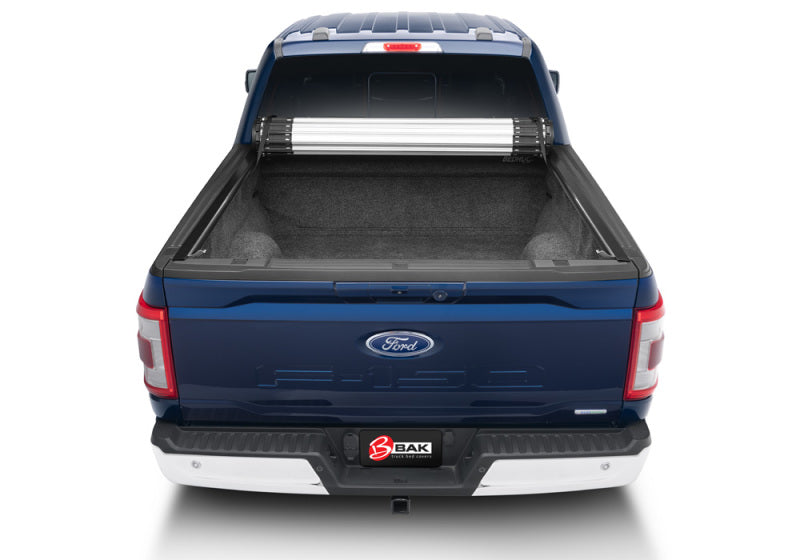 Blue ford truck bed installed with bak 17-23 revolver x2