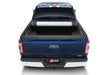 Blue ford super duty 8ft truck bed revolver x2 - back end view