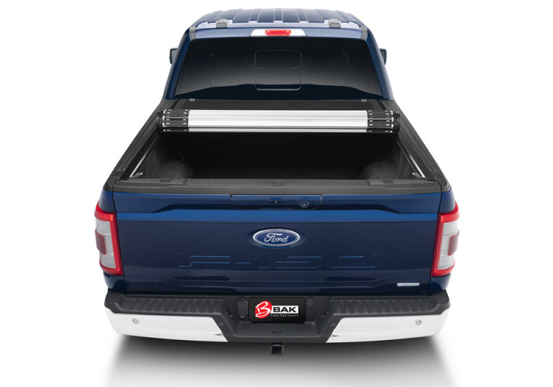 Blue ford super duty 8ft truck bed revolver x2 - back end view