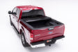 Red car with black roof on bak 17-23 ford super duty 8ft bed bakflip f1